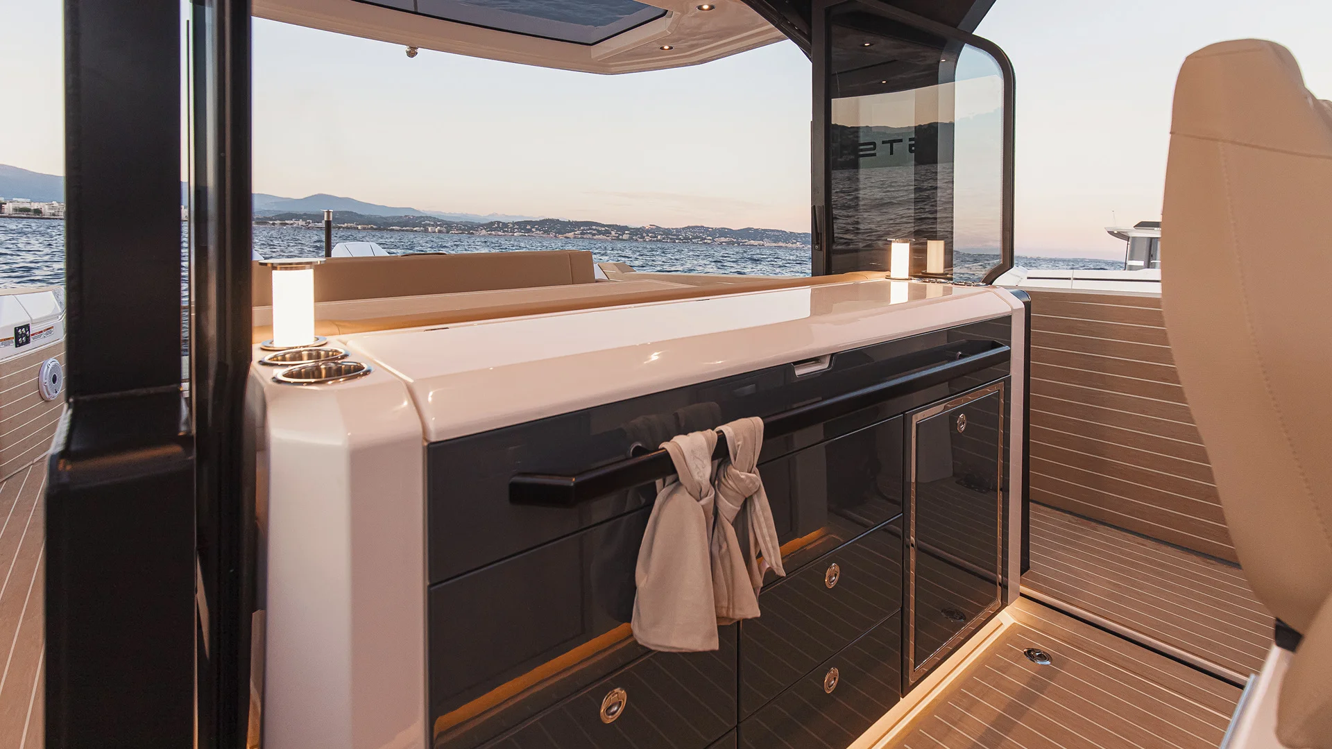 The outdoor galley, with refined cabinetry and a sea-facing counter