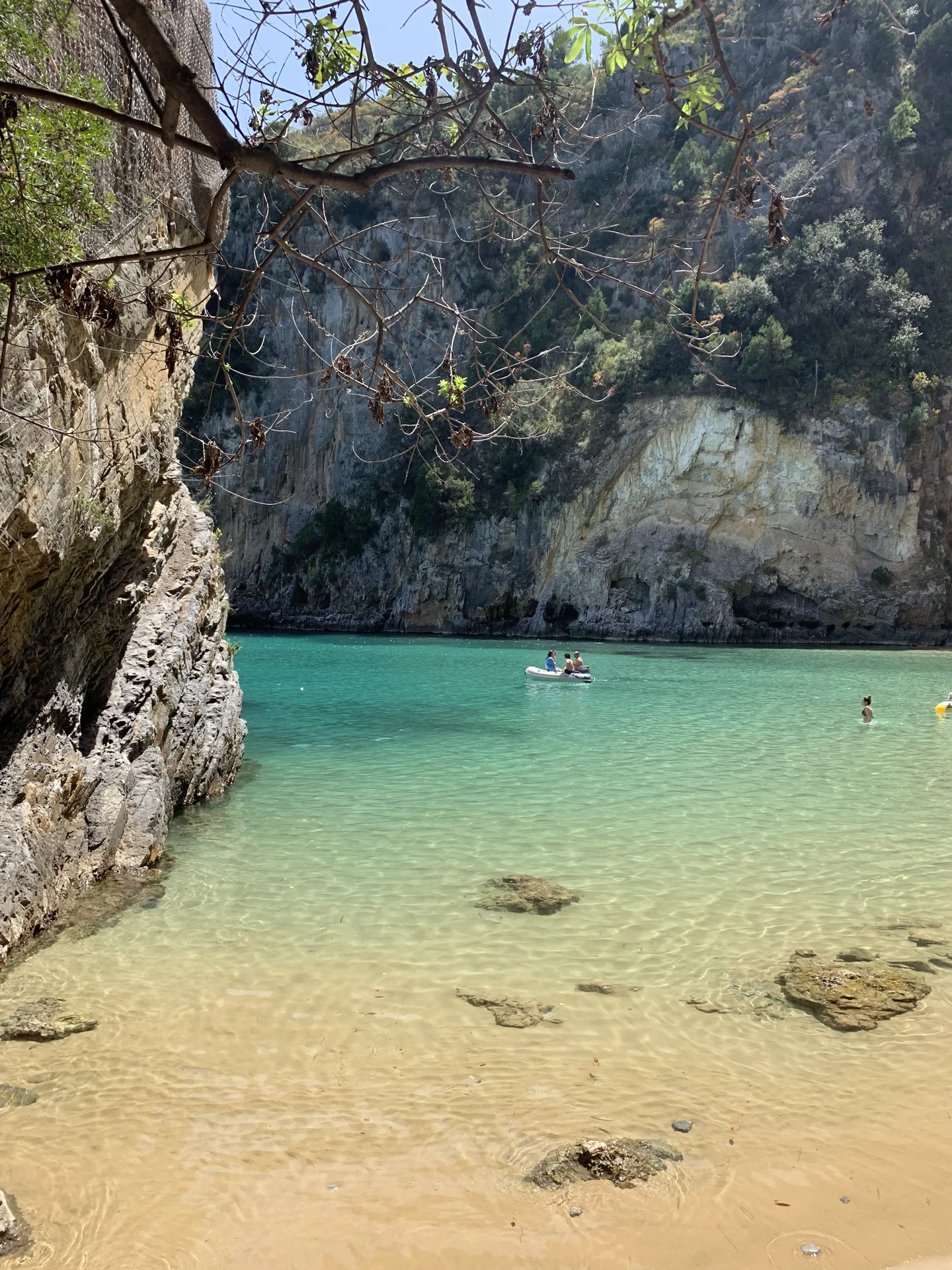 The natural cliffs and clear coastal waters of Baia del Buondormire, Palinuro